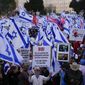 Israelis protest against Prime Minister Benjamin Netanyahu&#x27;s judicial overhaul plan outside the parliament in Jerusalem, Monday, March 27, 2023. (AP Photo/Ariel Schalit)