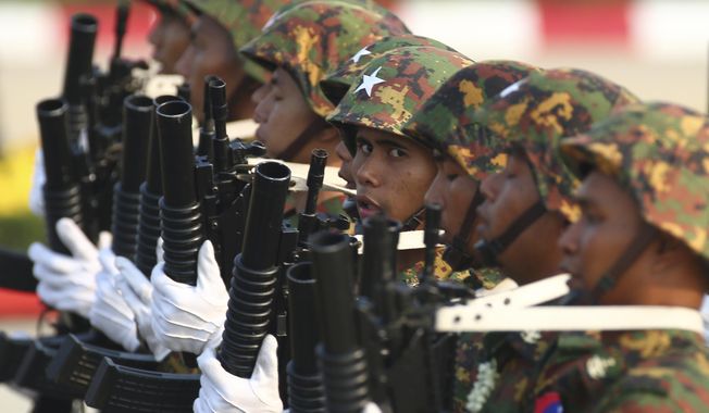 Military officers march during a parade to commemorate Myanmar&#x27;s 78th Armed Forces Day in Naypyitaw, Myanmar, Monday, March 27, 2023. (AP Photo/Aung Shine Oo)
