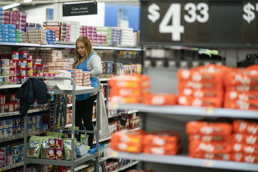 A worker organizes items at a Walmart Supercenter in North Bergen, N.J., on Feb. 9, 2023. (AP Photo/Eduardo Munoz Alvarez, File)