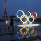 A display of the Olympic rings is set up on Trocadero plaza that overlooks the Eiffel Tower, after the vote in Lima, Peru, awarding the 2024 Games to the French capital, in Paris, France, Wednesday, Sept. 13, 2017. A proposed French law for the 2024 Paris Olympics that critics contend will open the door for privacy busting video surveillance technology in France and elsewhere in Europe faces an important hurdle Tuesday March 28, 2023 with lawmakers set to vote on it. The bill would legalize the temporary use of so-called &quot;intelligent&quot; surveillance systems to safeguard the Games and Paralympics. (AP Photo/Francois Mori, File)