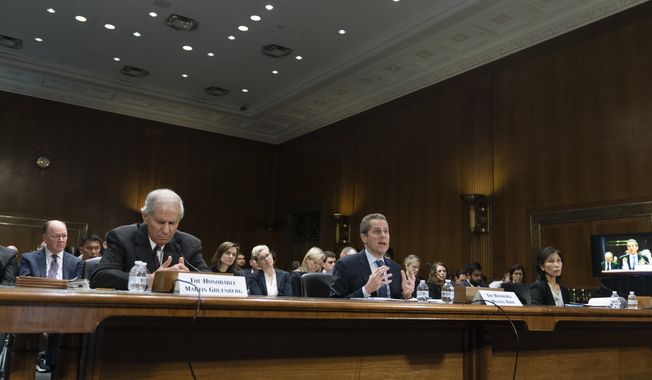 From left, Federal Deposit Insurance Corporation (FDIC) Chairman Martin Gruenberg; Michael Barr, Vice Chairman For Supervision of the Board of Governors of the Federal Reserve System and Nellie Liang, Undersecretary for Domestic Finance of the U.S. Department of the Treasury, testify before a Senate Banking, Housing, and Urban Affairs hearings to examine recent bank failures and the Federal regulatory response on Capitol Hill, Tuesday, March 28, 2023, in Washington. (AP Photo/Manuel Ba lce Ceneta)