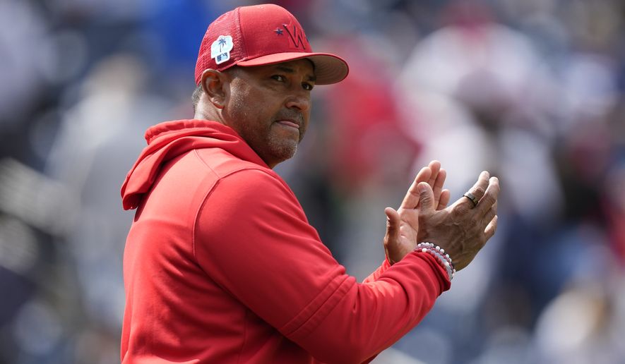 Washington Nationals manager Dave Martinez applauds after the Nationals closed out an exhibition baseball game against the New York Yankees, Tuesday, March 28, 2023, in Washington. Washington won 3-0. (AP Photo/Patrick Semansky)