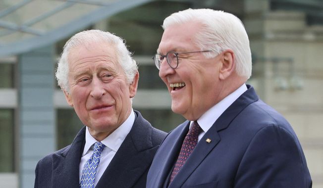 German President Frank-Walter Steinmeier, right, and Britain&#x27;s King Charles III attend a welcome ceremony, in Berlin, Germany, March 29, 2023.  (Wolfgang Rattay/Pool via AP)