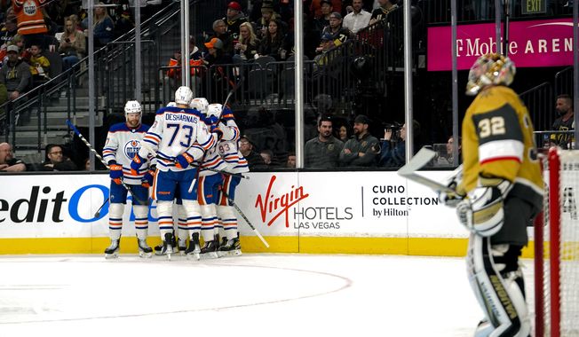 The Edmonton Oilers celebrate a goal against the Vegas Golden Knights during the first period of an NHL hockey game Tuesday, March 28, 2023, in Las Vegas. (AP Photo/Lucas Peltier)