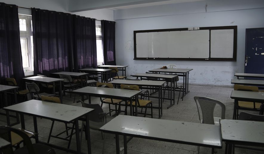 An empty classroom is seen in a school in the West Bank city of Bethlehem, Tuesday, March. 28, 2023. Palestinian public schools across the occupied West Bank have been shuttered since Feb. 5, in one of the longest teachers&#x27; strikes in recent memory against the cash-strapped Palestinian Authority.(AP Photo/Mahmoud Illean)