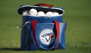 A bag of balls sits on the field before a spring training game between the Toronto Blue Jays and the Philadelphia Phillies on Friday, March 24, 2023, in Dunedin, Fla. (Mark Taylor/The Canadian Press via AP)