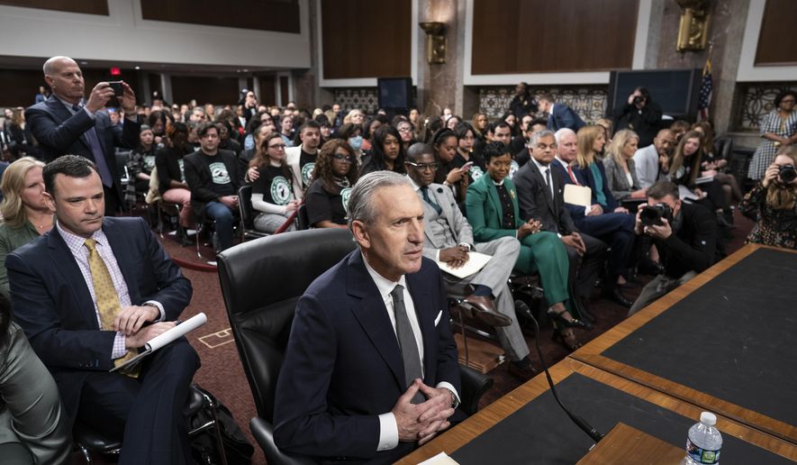 Longtime Starbucks CEO Howard Schultz takes his seat at a crowded Senate Health, Education, Labor and Pensions Committee hearing room where he expects to face sharp questioning about the company&#x27;s actions during an ongoing unionizing campaign, at the Capitol in Washington, Wednesday, March 29, 2023. (AP Photo/J. Scott Applewhite)