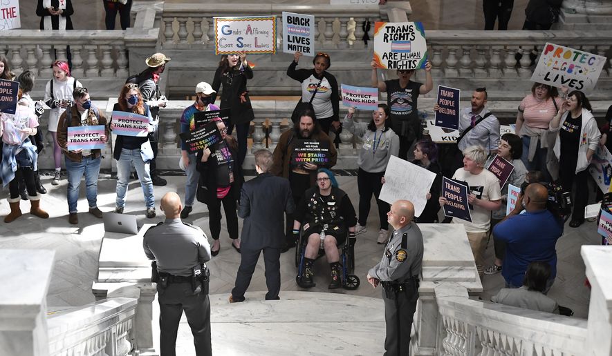 Protesters of Kentucky Senate bill SB150, known as the Transgender Health Bill gather at the steps of the Senate chamber of the Kentucky State Capitol in Frankfort, Ky., Wednesday, March 29, 2023. (AP Photo/Timothy D. Easley)