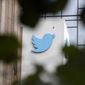 A sign at Twitter headquarters is shown in San Francisco, Dec. 8, 2022. Twitter says it has removed thousands of tweets showing a poster promoting a “trans day of vengeance” protest in support of transgender rights in Washington, D.C., on Saturday, March 25, 2023. (AP Photo/Jeff Chiu, File)