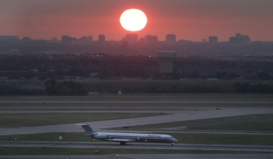 In this Aug. 26, 2015, photo, an American Airlines jet taxis on a runway as the sun rises in the east sky looking from the Dallas-Fort Worth International Airport in Grapevine, Texas. The federal government is spending more money on airport improvements designed to reduce the number of times that planes must taxi across active runways. Transportation Secretary Pete Buttigieg visited Dallas-Fort Worth International Airport on Thursday, March 30, 2023, to announce $29 million in federal money to help build a new taxiway at the nation&#x27;s second-busiest airport. (AP Photo/LM Otero) **FILE**