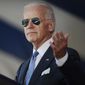 In this May 17, 2015, file photo, Vice President Joe Biden gestures after donning a pair of sunglasses as he delivers the Class Day Address at Yale University in New Haven, Conn. (AP Photo/Jessica Hill, File)