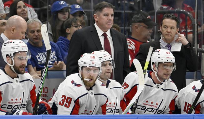 Washington Capitals head coach Peter Laviolette looks on during the third period of an NHL hockey game against the Tampa Bay Lightning Thursday, March 30, 2023, in Tampa, Fla. (AP Photo/Jason Behnken)