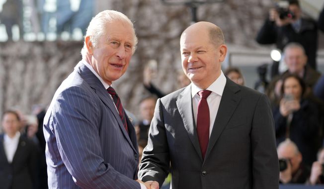 German Chancellor Olaf Scholz welcomes Britain&#x27;s King Charles III at the chancellery in Berlin, Thursday, March 30, 2023. King Charles III arrived Wednesday for a three-day official visit to Germany. (AP Photo/Matthias Schrader)