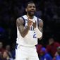 Dallas Mavericks&#x27; Kyrie Irving reacts during the first half of an NBA basketball game against the Philadelphia 76ers, Wednesday, March 29, 2023, in Philadelphia. (AP Photo/Matt Slocum)