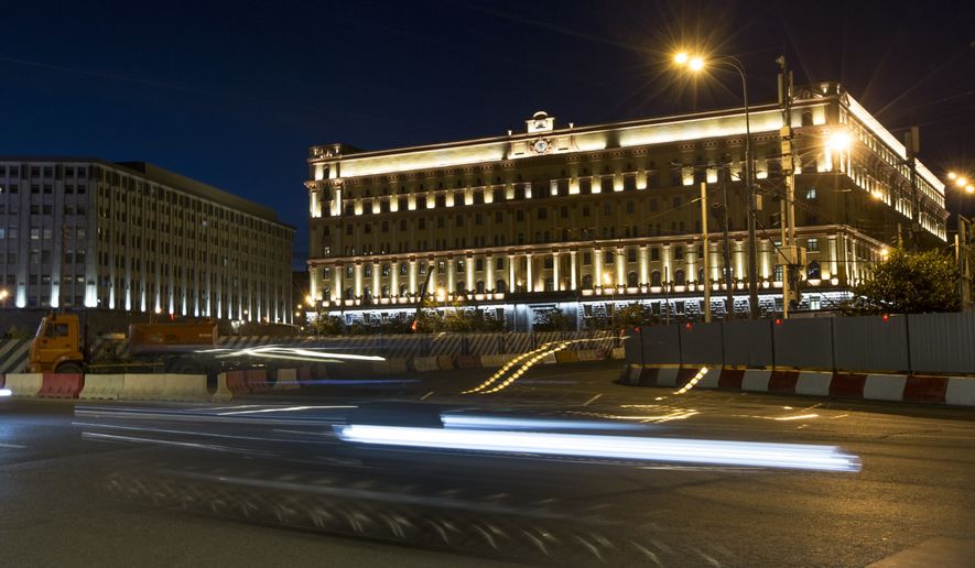 A car passes the building of the Federal Security Service (FSB, Soviet KGB successor) in Lubyanskaya Square in Moscow, Russia, on Monday, July 24, 2017. Russia’s top security agency says a reporter for The Wall Street Journal has been arrested on espionage charges. The Federal Security Service (FSB), the top KGB successor agency, said Thursday, March 30, 2023, that Evan Gershkovich was detained in the Ural Mountains city of Yekaterinburg while allegedly trying to obtain classified information. (AP Photo, File)