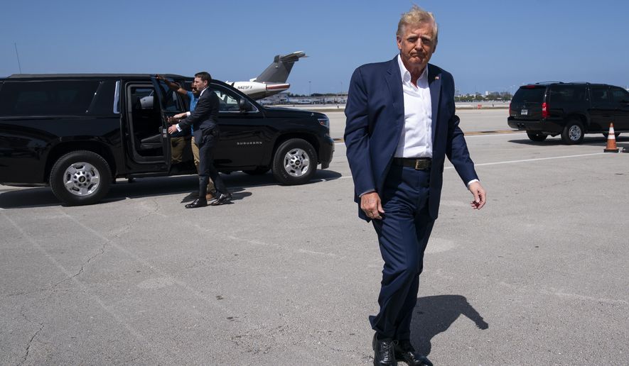 Former President Donald Trump arrives to boars his airplane for a trip to a campaign rally in Waco, Texas, at West Palm Beach International Airport, Saturday, March 25, 2023, in West Palm Beach, Fla. (AP Photo/Evan Vucci) **FILE**