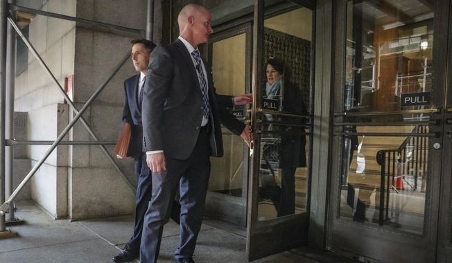 Prosecutors Matthew Colangelo, left, and Susan Hoffinger, right, leave a state office building , Thursday March 30, 2023, in New York. A lawyer for Donald Trump said Thursday he&#x27;s been told that the former president has been indicted in New York on charges involving payments made during the 2016 presidential campaign to silence claims of an extramarital sexual encounter. (AP Photo/Bebeto Matthews)