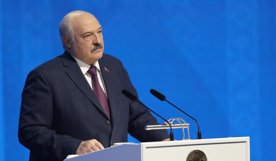 In this photo provided by the Belarusian Presidential Press Service, Belarusian President Alexander Lukashenko delivers a state-of-the nation address in Minsk, Belarus, Friday, March 31, 2023. (Belarusian Presidential Press Service via AP)