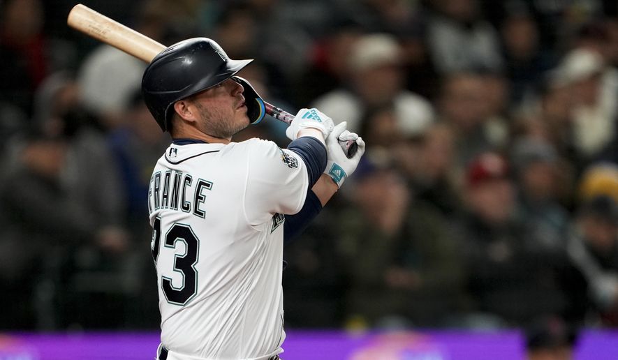 Seattle Mariners&#x27; Ty France watches his double to center field against the Cleveland Guardians during the sixth inning during an opening day baseball game Thursday, March 30, 2023, in Seattle. (AP Photo/Lindsey Wasson)