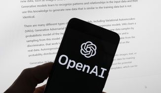 The OpenAI logo is seen on a mobile phone in front of a computer screen displaying output from ChatGPT, on March 21, 2023, in Boston. The Italian government’s privacy watchdog said Friday, March 31, 2023, that it is temporarily blocking the artificial intelligence software ChatGPT in the wake of a data breach. (AP Photo/Michael Dwyer, File)