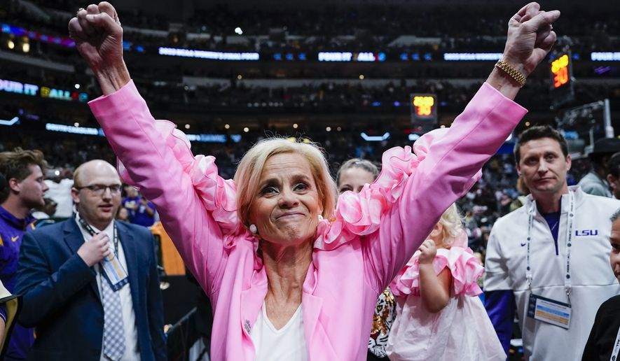 LSU head coach Kim Mulkey celebrates after an NCAA Women&#x27;s Final Four semifinals basketball game against Virginia Tech Friday, March 31, 2023, in Dallas. LSU won 79-72 to advance to the championship game on Sunday. (AP Photo/Darron Cummings)