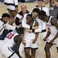 San Diego State guard Lamont Butler, center, celebrates with teammates after he hit the winning basket against Florida Atlantic during the second half of a Final Four college basketball game in the NCAA Tournament on Saturday, April 1, 2023, in Houston. (AP Photo/Godofredo A. Vasquez)