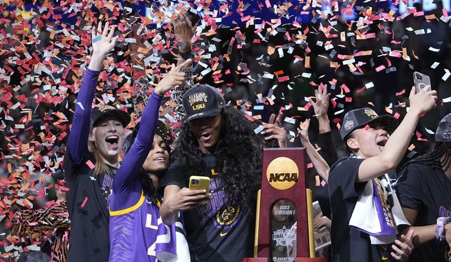 LSU players celebrate after the NCAA Women&#x27;s Final Four championship basketball game against Iowa Sunday, April 2, 2023, in Dallas. LSU won 102-85 to win the championship. (AP Photo/Darron Cummings)
