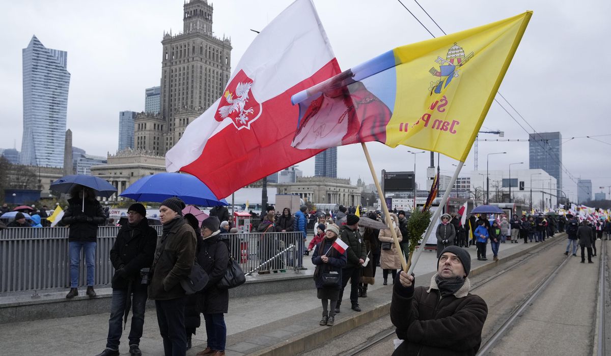 NextImg:Poland marches defend John Paul II from abuse cover-up claim