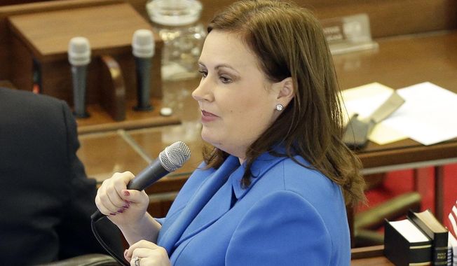 State Rep. Tricia Cotham, D-Mecklenburg, speaks on the House floor as North Carolina lawmakers gather for a special session on March 23, 2016, in Raleigh, N.C. Speculation is brewing in North Carolina that Cotham may change her party affiliation. Republicans have scheduled a news conference Wednesday, April 5, 2023, with Cotham, of Mecklenburg County. If Cotham does switch parties, the move would give the GOP complete veto-proof control of the General Assembly and hand Democratic Gov. Roy Cooper a major political setback. (AP Photo/Gerry Broome, File)