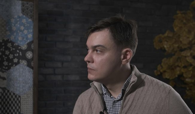In this image from video provided by the Dossier Center, a London-based investigative group funded by Russian opposition figure Mikhail Khodorkovsky, Gleb Karakulov speaks during an interview in Turkey in December 2022. Karakulov, who was responsible for setting up secure communications for Russian President Vladimir Putin, said moral opposition to Russia’s invasion of Ukraine and his fear of dying there drove him to speak out, despite the risks to himself and his family. He said he hoped to inspire other Russians to speak out also. “Our President has become a war criminal,” he said. “It is time to end this war and stop being silent.” (Dossier Center via AP)