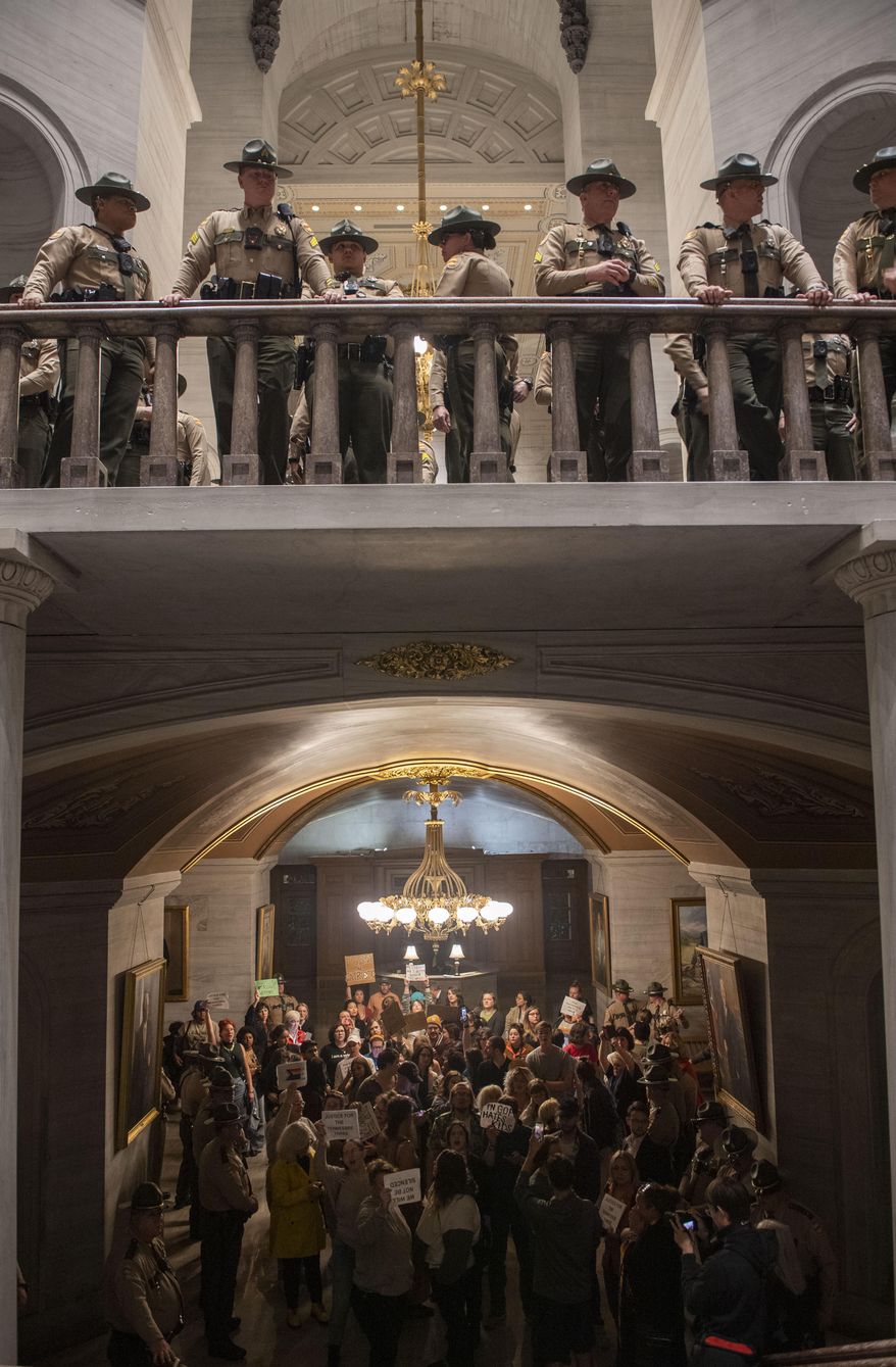 State Troopers fill the rotunda as people are directed downstairs after it was announced Republicans began the process of expelling Democratic Reps. Justin Pearson of Memphis, Rep. Justin Jones of Nashville, and Rep. Gloria Johnson of Knoxville, during a House session at Tennessee state Capitol Building in Nashville, Tenn., Monday, April 3, 2023. Tennessee Republican lawmakers have taken the first steps to expel three Democratic members from the GOP-dominant House for their role in a recent gun control protest at the state Capitol. (Nicole Hester /The Tennessean via AP)