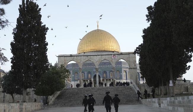 Israeli police are deployed at the Dome of the Rock Mosque in the Al-Aqsa Mosque compound following a raid at the site during the Muslim Holy month of Ramadan in the Old City of Jerusalem, Wednesday, April 5, 2023. Palestinian media reported police attacked Palestinian worshippers, raising fears of wider tension as Islamic and Jewish holidays overlap. (AP Photo/Mahmoud Illean)