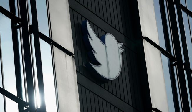 A Twitter logo hangs outside the company&#x27;s offices in San Francisco, on Dec. 19, 2022. (AP Photo/Jeff Chiu, File)
