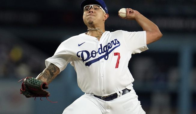 Los Angeles Dodgers starting pitcher Julio Urias throws to a Colorado Rockies batter during the second inning of a baseball game Tuesday, April 4, 2023, in Los Angeles. (AP Photo/Marcio Jose Sanchez)