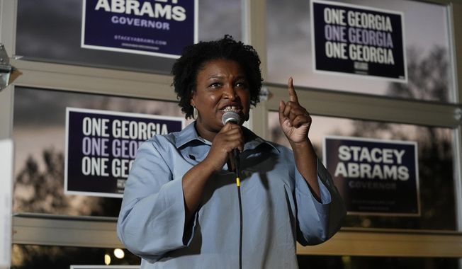 Democratic candidate for Georgia governor Stacey Abrams speaks to volunteers during an election eve phone and text bank party, Nov. 7, 2022, in Atlanta. Howard University in Washington announced Wednesday, April, 5, 2023, that Abrams would be joining its faculty. (AP Photo/John Bazemore, File)
