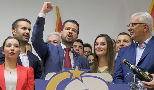 Jakov Milatovic, center left, leader of the Europe Now movement, celebrates in his headquarters in Montenegro&#x27;s capital Podgorica, Sunday, April 2, 2023. Milatovic, an economy expert and political novice, won the presidential runoff election on Sunday, defeating the pro-Western incumbent who has been in power for more than three decades in the small NATO member nation in Europe, the candidates and polls said.(AP Photo/Risto Bozovic)