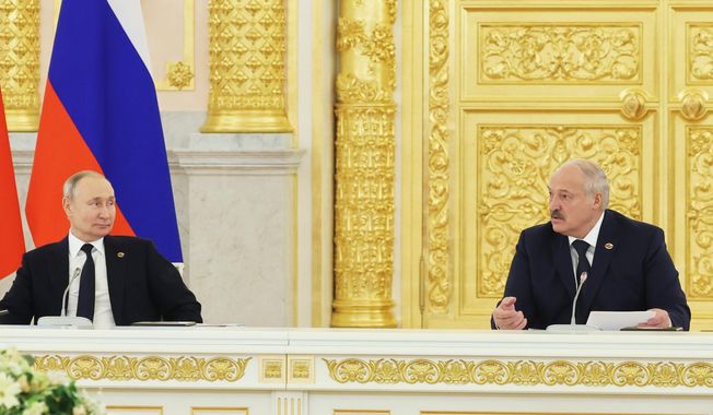 Belarusian President Alexander Lukashenko, right, and Russian President Vladimir Putin attend the Supreme State Council of the Union State Russia-Belarus meeting in Moscow, Russia, Thursday, April 6, 2023. (Mikhail Klimentyev, Sputnik, Kremlin Pool Photo via AP)