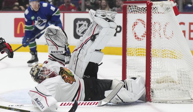 Chicago Blackhawks goalie Alex Stalock stops Vancouver Canucks&#x27; Anthony Beauvillier, not seen, during the second period of an NHL hockey game Thursday, April 6, 2023, in Vancouver, British Columbia. (Darryl Dyck/The Canadian Press via AP)