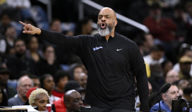 Washington Wizards coach Wes Unseld Jr. gestures during the first half of the team&#x27;s NBA basketball game against the Miami Heat, Friday, April 7, 2023, in Washington. (AP Photo/Nick Wass) **FILE**