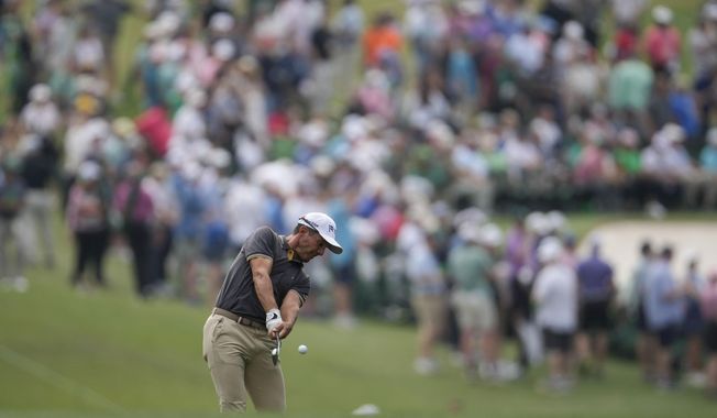 Mike Weir, of Canada, hits from the fairway on the first hole during the second round of the Masters golf tournament at Augusta National Golf Club on Friday, April 7, 2023, in Augusta, Ga. (AP Photo/Matt Slocum)