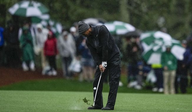 Tiger Woods hits from the fairway on the 15th hole during the weather delayed third round of the Masters golf tournament at Augusta National Golf Club on Saturday, April 8, 2023, in Augusta, Ga. (AP Photo/Matt Slocum)