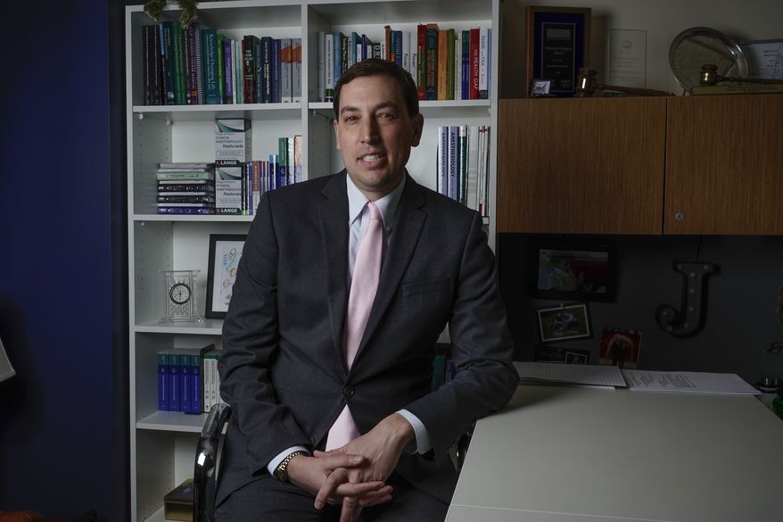 American Medical Association President-Elect Dr. Jesse M. Ehrenfeld poses for a picture in his office at the Medical College of Wisconsin Friday, March 24, 2023, in Milwaukee. (AP Photo/Morry Gash)