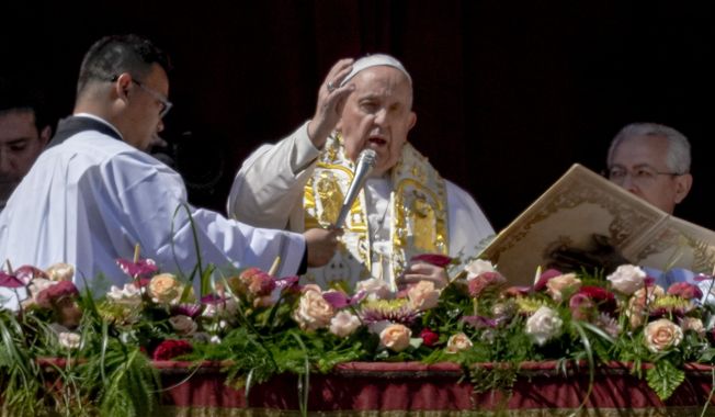 Pope Francis bestows the plenary &#x27;Urbi et Orbi&#x27; (to the city and to the world) blessing from the central lodge of the St. Peter&#x27;s Basilica at The Vatican at the end of the Easter Sunday mass, Sunday, April 9, 2023. (AP Photo/Alessandra Tarantino)