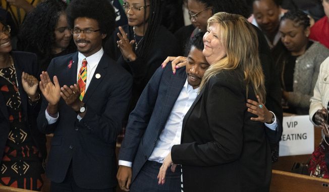 Expelled Rep. Justin Pearson, D-Memphis, from left, expelled Rep. Justin Jones, D-Nashville, and Rep. Gloria Johnson, D-Knoxville, are recognized by the audience at Fisk University before Vice President Kamala Harris arrives, Friday, April 7, 2023, in Nashville, Tenn. (AP Photo/George Walker IV)