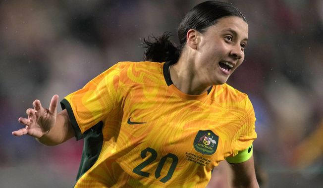 Australia&#x27;s Sam Kerr celebrates after scoring against England during the women&#x27;s international friendly soccer match between England and Australia at the Gtech Community Stadium in London, England, Tuesday, April 11, 2023. (AP Photo/Kin Cheung)