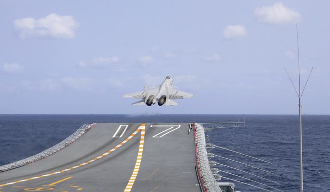 In this photo released by Xinhua News Agency, a J-15 Chinese fighter jet takes off from the Shandong aircraft carrier during the combat readiness patrol and military exercises around the Taiwan Island by the Eastern Theater Command of the Chinese People&#x27;s Liberation Army (PLA) on Sunday, April 9, 2023. China&#x27;s military declared Monday it is &quot;ready to fight&quot; after completing three days of large-scale combat exercises around Taiwan that simulated sealing off the island in response to the Taiwanese president&#x27;s trip to the U.S. last week. (An Ni/Xinhua via AP)