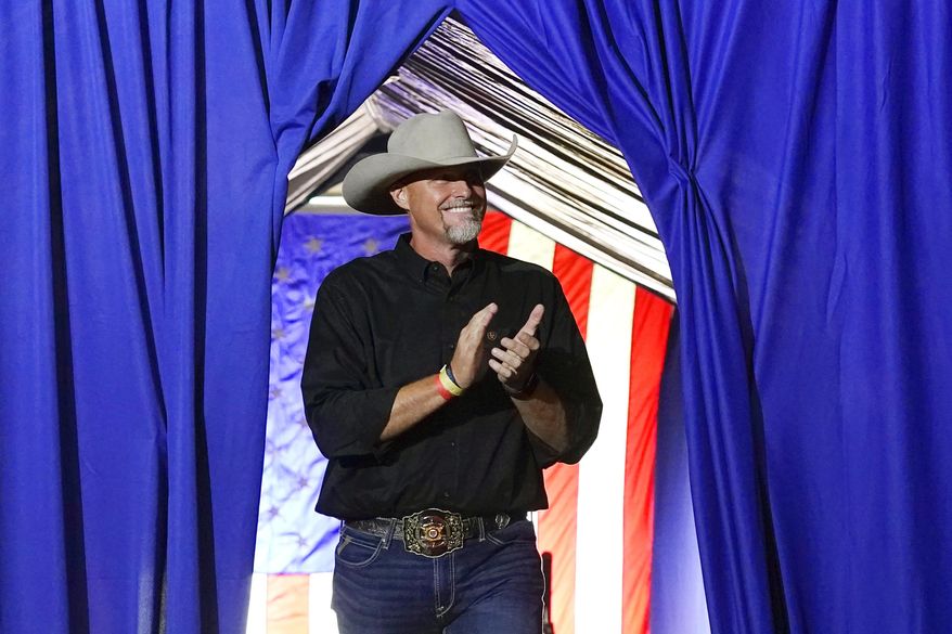 Pinal County Sheriff Mark Lamb applauds as he walks on stage at a Save America Rally in Prescott, Ariz., on Friday, July 22, 2022. (AP Photo/Ross D. Franklin) **FILE**