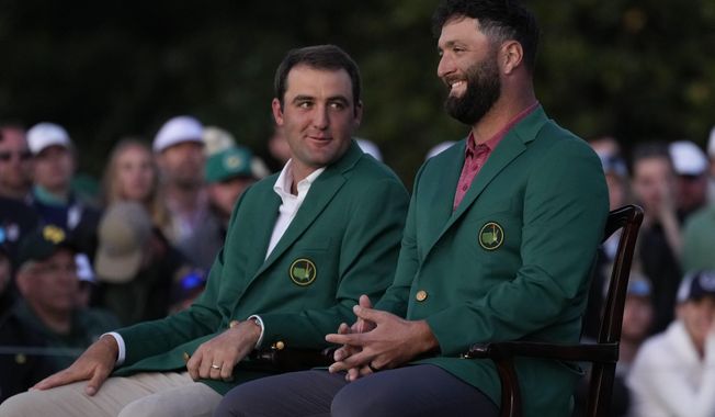 Scottie Scheffler sits with Jon Rahm, of Spain, after Rahm won the Masters golf tournament at Augusta National Golf Club on Sunday, April 9, 2023, in Augusta, Ga.(AP Photo/Jae C. Hong) **FILE**