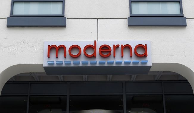 A sign marks an entrance to a Moderna building in Cambridge, Mass., on Monday, May 18, 2020. Moderna shares slipped Tuesday, April 11, 2023, after the COVID-19 vaccine developer said its potential flu vaccine needs more study in a late-stage clinical trial. (AP Photo/Bill Sikes) **FILE**