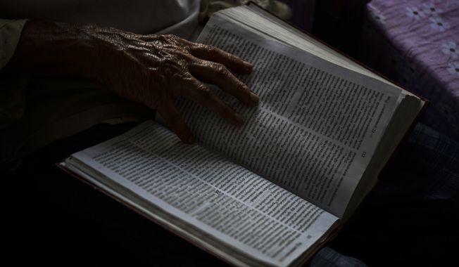 K.A. Chacko, 85, spends time reading the Bible at the Signature senior living facility in Kochi, Kerala state, India, March 6, 2023. In this coastal state in India&#x27;s southern tip, the aging population provides a stark contrast to the young India of the north. The most literate state in India, Kerala is also the fastest aging part of the country. Declining fertility and increasing longevity have been contributing to the demographic shifts in the State. (AP Photo/R.S. Iyer)